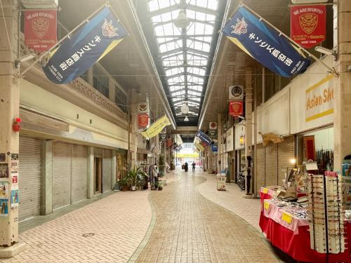 an empty aisle of a store with a ceiling at Arcade Resort Okinawa in Okinawa City