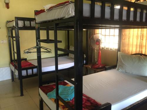 Katil atau katil-katil dalam bilik di IKI IKI Guesthouse