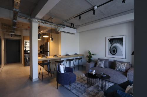 a living room with a couch and a table at C Living 3 - Al Malqa in Riyadh