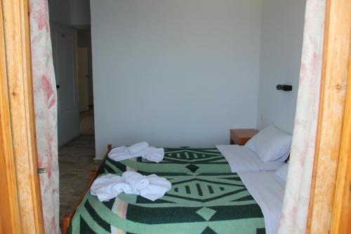 Postel nebo postele na pokoji v ubytování Hotel Alkyon
