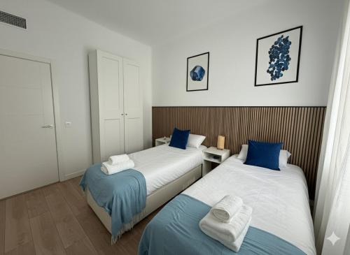 Ένα ή περισσότερα κρεβάτια σε δωμάτιο στο Retiro Residence Zafiro