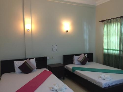 Katil atau katil-katil dalam bilik di IKI IKI Guesthouse