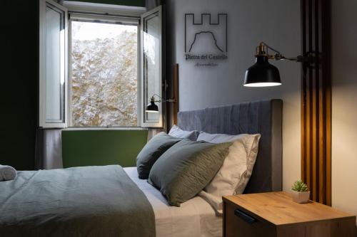 Ένα ή περισσότερα κρεβάτια σε δωμάτιο στο Pietra del Castello