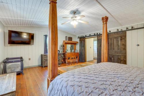 a bedroom with a bed and a tv in it at Mossy Creek Cabin in Cleveland