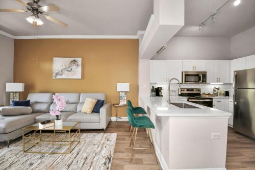 a kitchen and living room with a couch and a table at Nrg Stadium Rodeo Unit in Houston