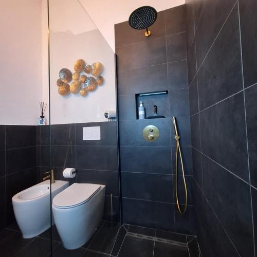 a bathroom with a toilet and a shower stall at La coccinella in Castelfiorentino