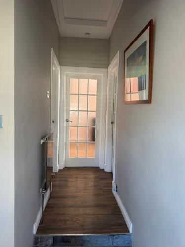 a hallway with a door leading into a room at City break in Edinburgh