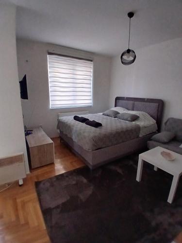 Ένα ή περισσότερα κρεβάτια σε δωμάτιο στο Sarajevo Holiday Apartment 4