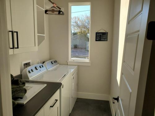 a small kitchen with a sink and a window at Actually walkable to square & Private Heated Pool in Georgetown
