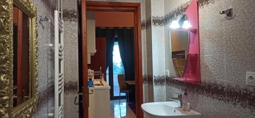 a bathroom with a sink and a mirror at Tokastro2 in Arachova