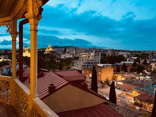 a view of a city from a balcony at Anano Apartment on Botanikuri in Tbilisi City