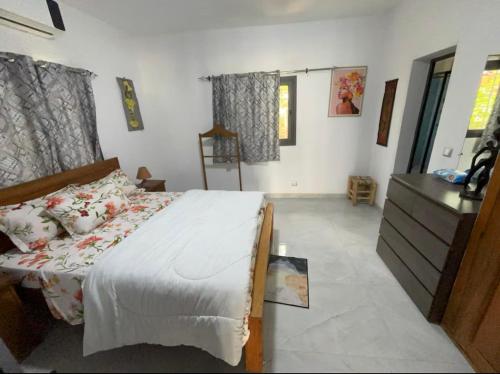 Llit o llits en una habitació de Villa Fatou