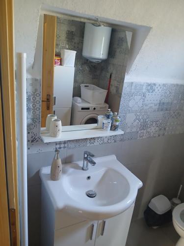 a bathroom with a sink and a mirror at D&N place - forest house Zabljak in Žabljak