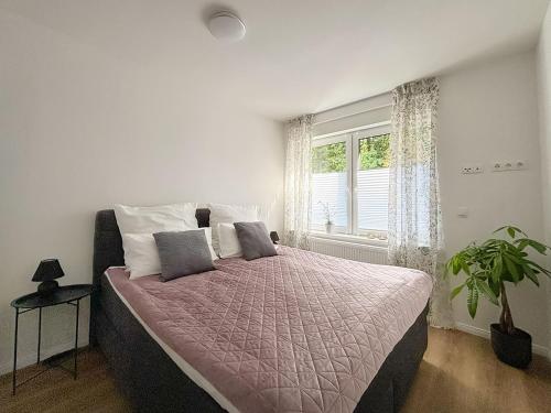 Postel nebo postele na pokoji v ubytování Ferienwohnungen Take off