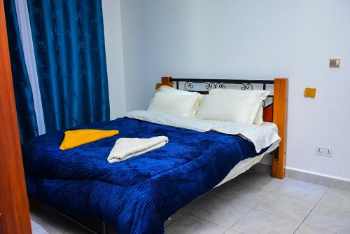 Ένα ή περισσότερα κρεβάτια σε δωμάτιο στο Polo Executive Abodes