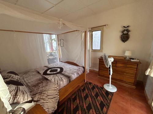 a bedroom with a zebra print bed in a room at Casa Jujube - Guest House in Dakar