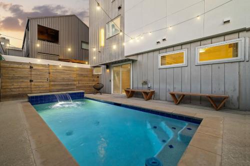 a swimming pool in the backyard of a house at Ellum House in Dallas