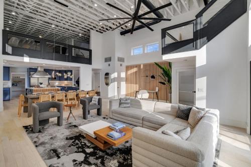 a living room with a couch and a table at Ellum House in Dallas