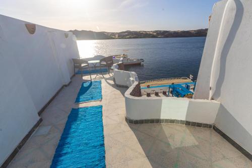 a balcony of a boat in the water at Nubian Spirit in Aswân Reservoir Colony