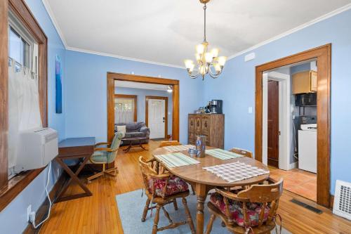 a kitchen and dining room with a table and chairs at Historic 2 Bdr across from Lakeside Park in Fort Wayne