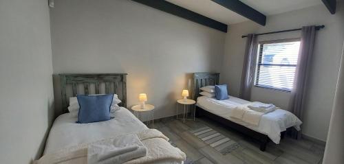 En eller flere senge i et værelse på De Meye Jacobsbaai