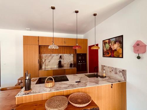 a kitchen with a counter and a counter top at 6-person villa with pool in La Celle-sous-Gouzon