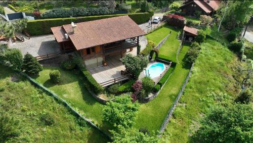 an aerial view of a house with a swimming pool at Chalé do Pinheiro in Vila Nova de Cerveira