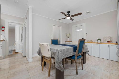 a kitchen and dining room with a table and chairs at Vintage West Central Apt Walkable Free Parking! in Fort Wayne