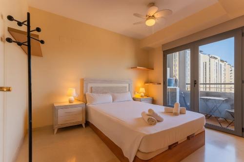 Ліжко або ліжка в номері VLC New Downtown Apartment