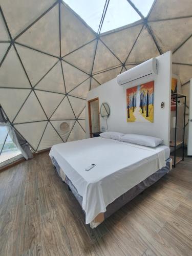 En eller flere senge i et værelse på Hotel y restaurante villa marquez