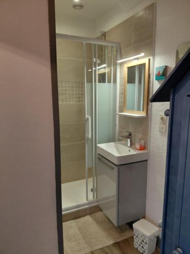 a bathroom with a shower and a sink at Donemat in Arzon