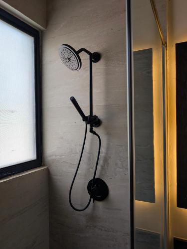 a shower in the corner of a bathroom at Luxury 4 Bedroom Villa with Private Pool in Tulum