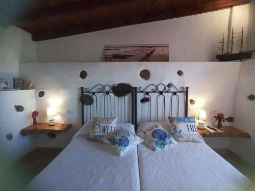 a bedroom with two beds with blue pillows at Vivaldi Summer in Icod de los Vinos