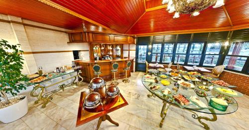 a large room with a table with plates of food at Valide Sultan Konagi in Istanbul