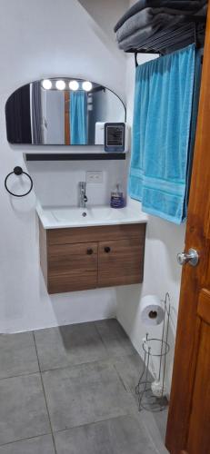 a bathroom with a sink and a mirror at Villa Don Juan in Rivas