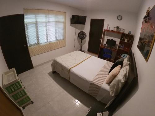 Postel nebo postele na pokoji v ubytování Casa Osiris