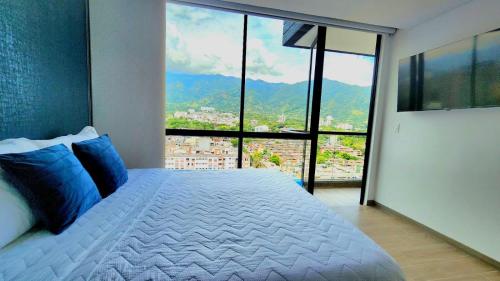 Un pat sau paturi într-o cameră la Apartamento Luxury ubicado en la mejor zona comercial de la ciudad