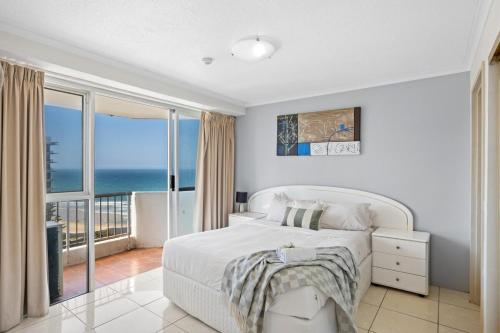 Кровать или кровати в номере Beachside Apartment