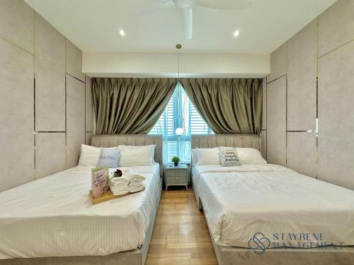 Katil atau katil-katil dalam bilik di Iskandar Residences Nusajaya by Stayrene