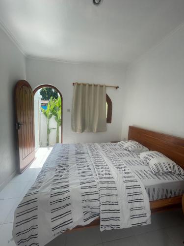 Postel nebo postele na pokoji v ubytování Casa Feliz Guest House