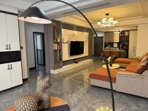 a living room with a couch and a table at Xiaowo SmileNest Downtown Scenic Spot Ticket Service Close to Tianmen Mountain Scenic Area Ideal for Couples, Families and Group Bookings in Zhangjiajie