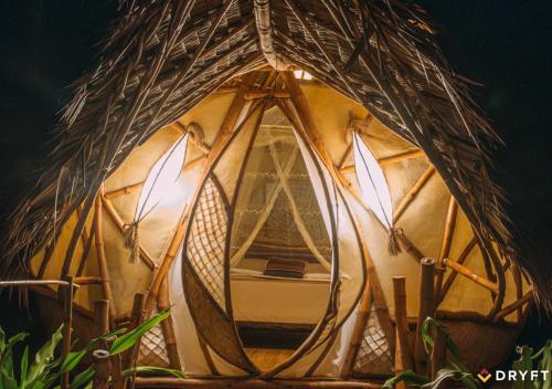 a boat is inside of a round tent at Dryft Darocotan Island in El Nido