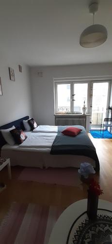 a bedroom with a large bed in a room at Wonderful Stay Helsingborg in Helsingborg