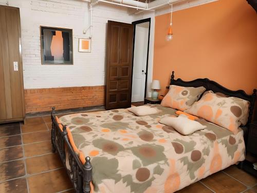 a bedroom with a large bed in a room at Ethlyn House in Bocas del Toro