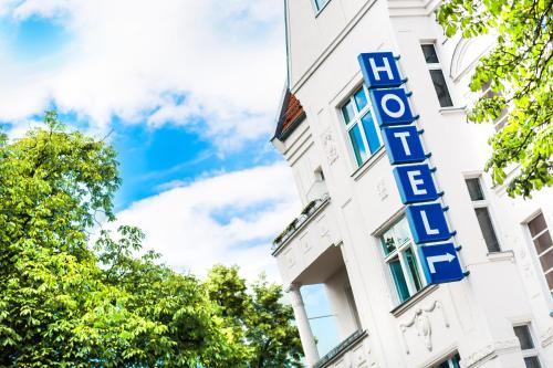 a hotel sign on the side of a building at Anna 1908 in Berlin