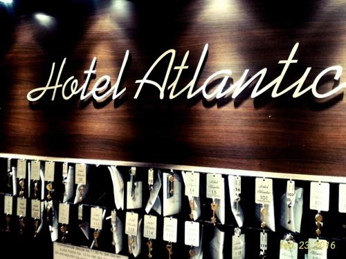 a sign that says hotel alhambra on a wall at Hotel Atlantic in Mar del Plata
