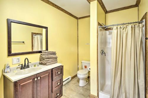 a bathroom with a sink and a toilet and a mirror at Suite To Unwind Autumn Midweek - 35 Off Promo! in Pleasant Mount