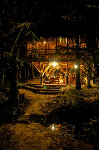 a night time picture of a building with lights at Universo Pol Bamboo Hostel in Morro de São Paulo
