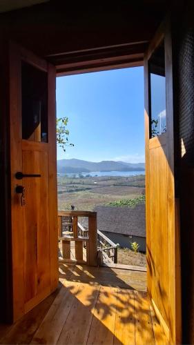 an open door to a porch with a view at Bukit Samudra in Lemonga