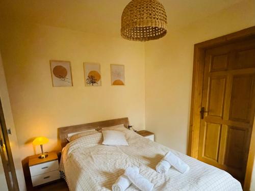 Ένα ή περισσότερα κρεβάτια σε δωμάτιο στο Toma Guesthouse
